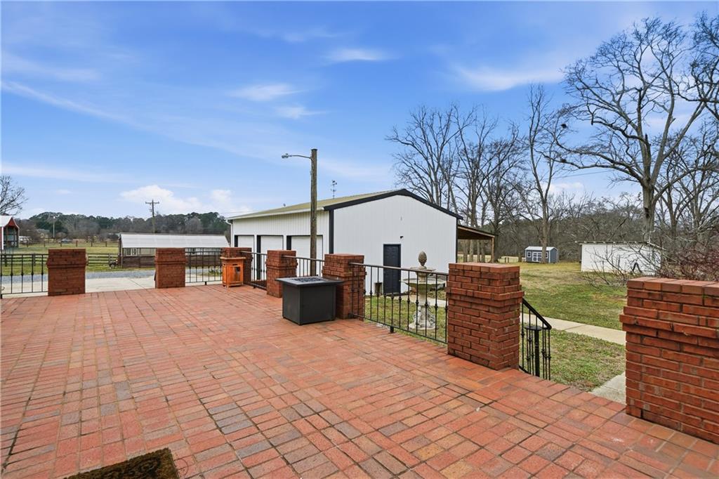 880 Johnstonville Road Barnesville, GA 30204 - Photo 28 of 33 a view of a terrace with chairs