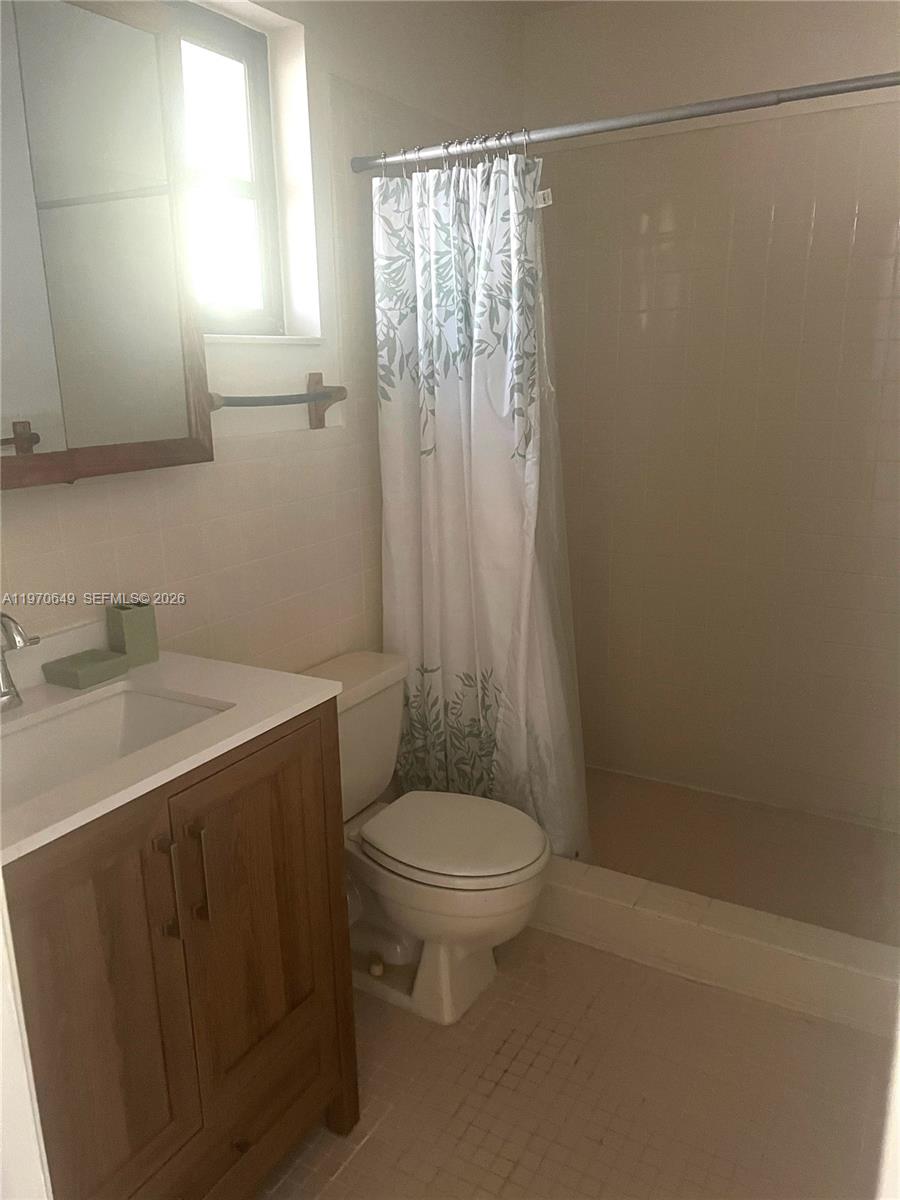 14435 Southwest 289th Street Homestead, FL 33033 - Photo 12 of 18 a bathroom with a sink a toilet and shower