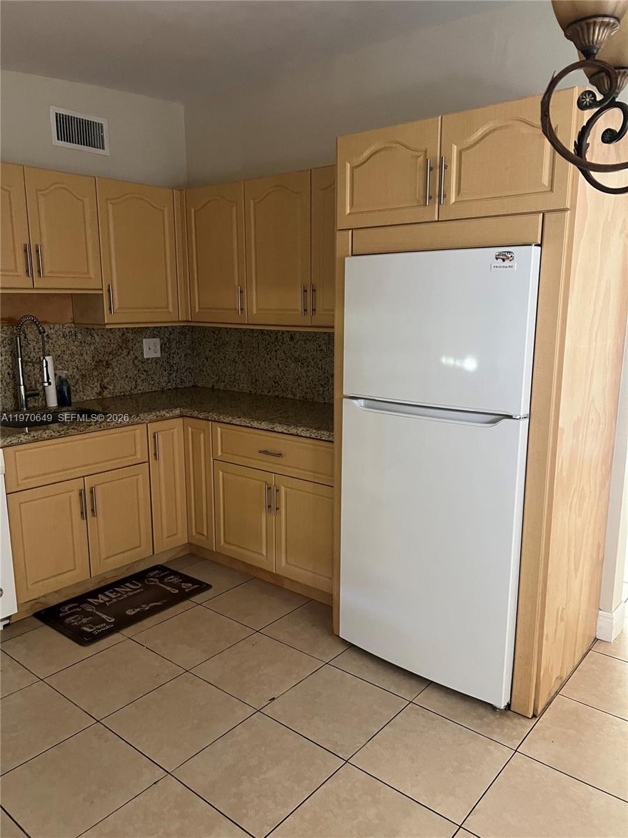14435 Southwest 289th Street Homestead, FL 33033 - Photo 7 of 18 a utility room with cabinets washer and dryer