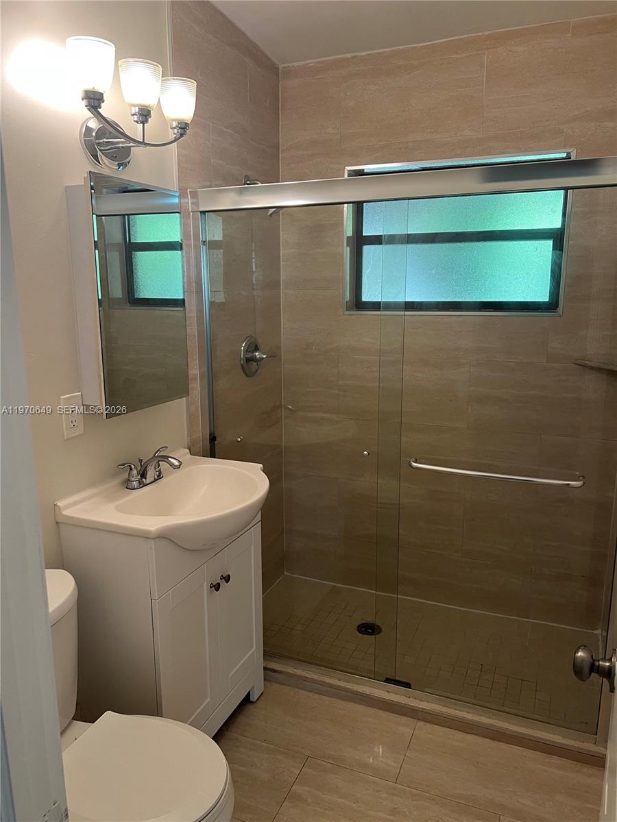 14435 Southwest 289th Street Homestead, FL 33033 - Photo 10 of 18 a bathroom with a sink toilet and shower