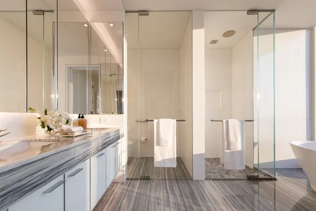 a bathroom with a double vanity sink and a mirror