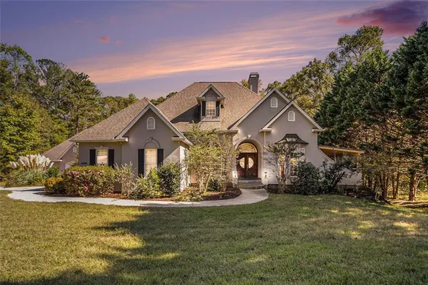 a front view of a house with a yard