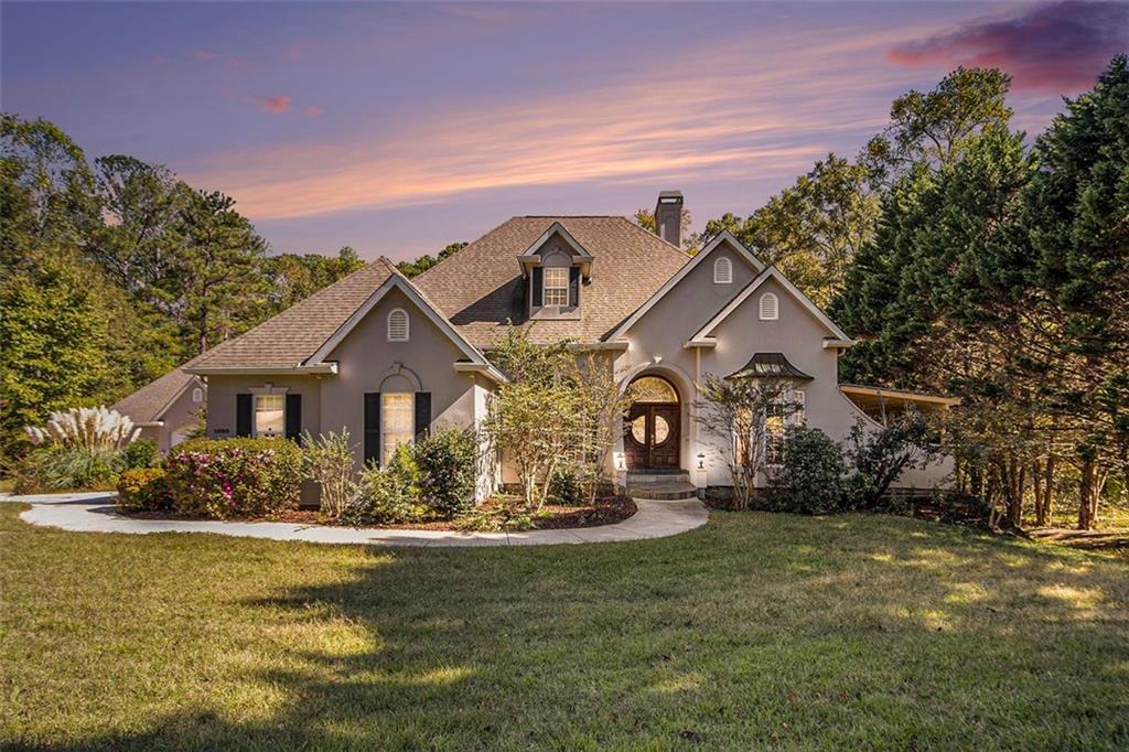 a front view of a house with a yard