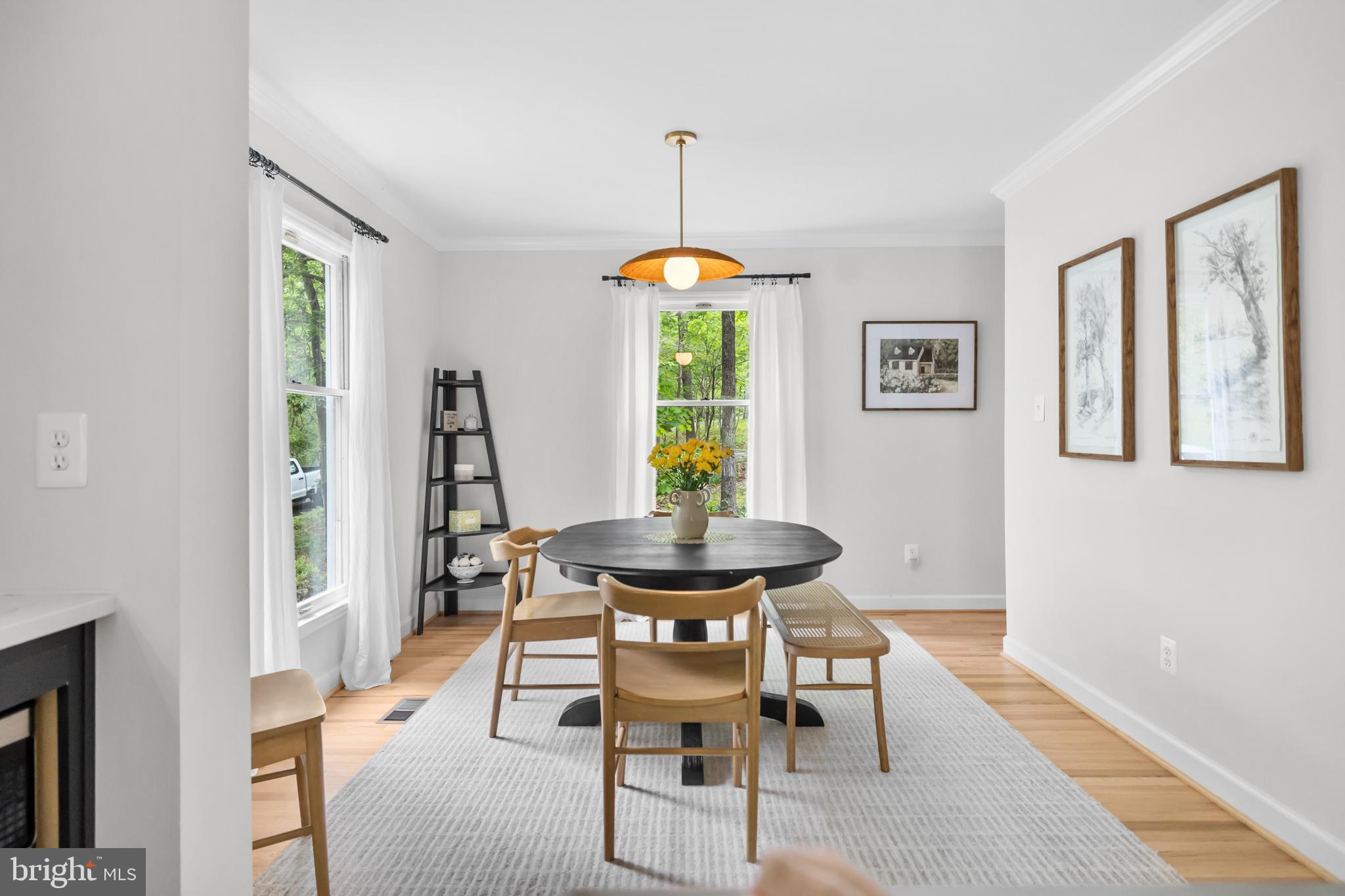 20808 Wild Goose Lane Leesburg, VA 20175 - Photo 30 of 86 a view of a dining room with furniture window and wooden floor