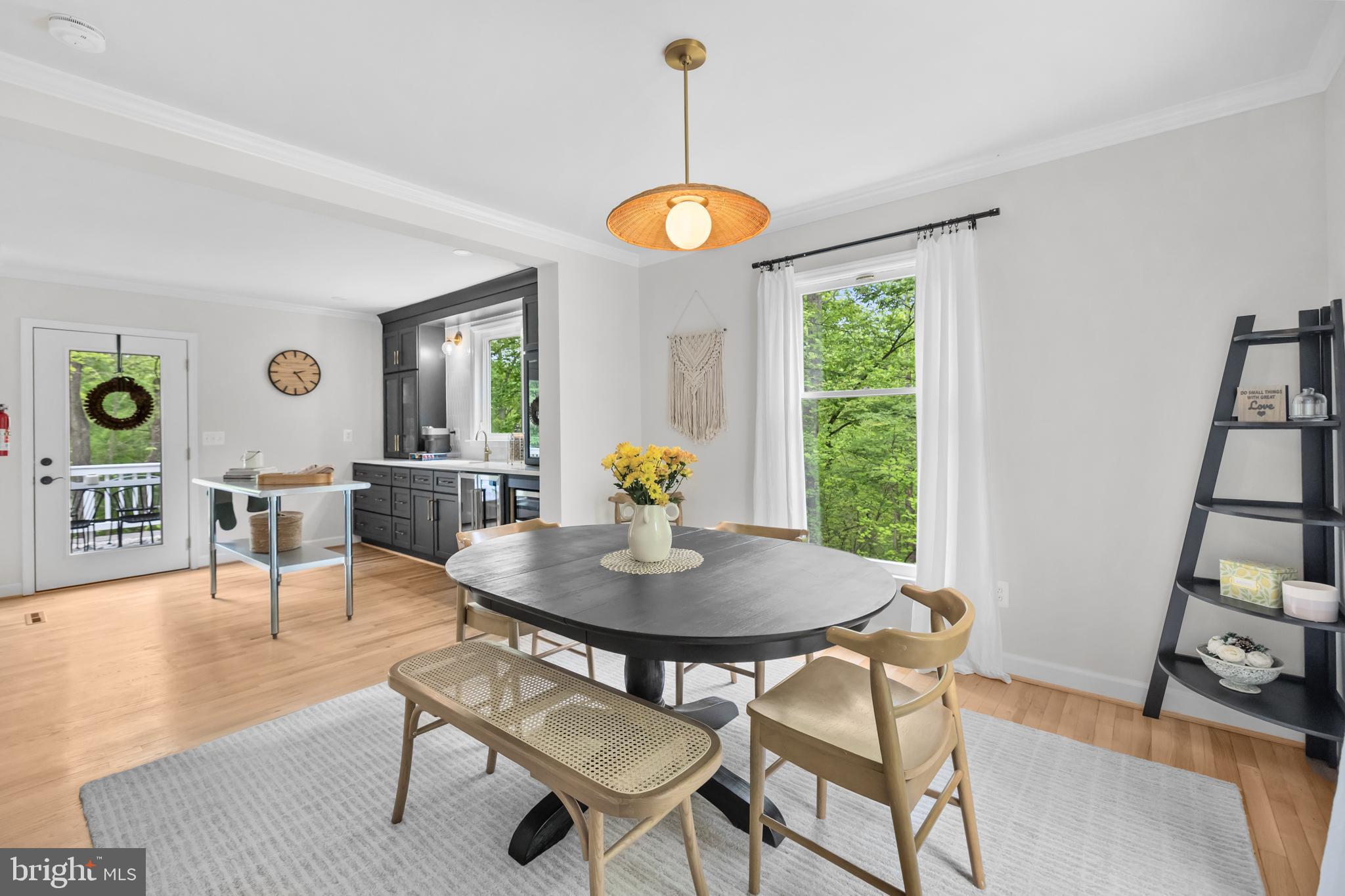 20808 Wild Goose Lane Leesburg, VA 20175 - Photo 32 of 86 a view of a dining room with furniture window and wooden floor