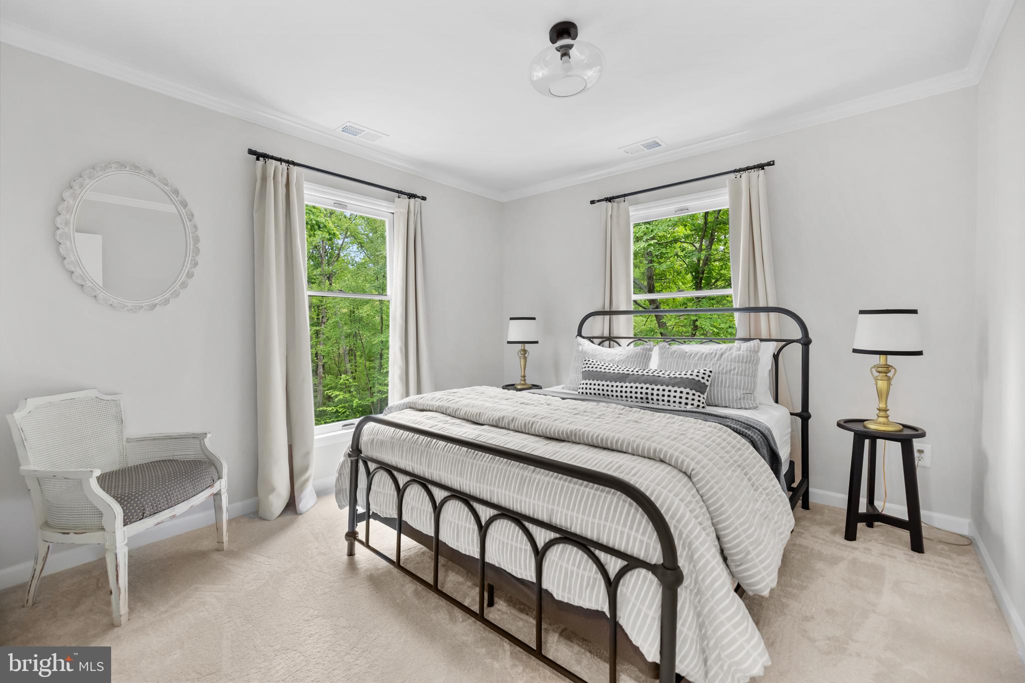 20808 Wild Goose Lane Leesburg, VA 20175 - Photo 44 of 86 a bedroom with a bed a table and chair