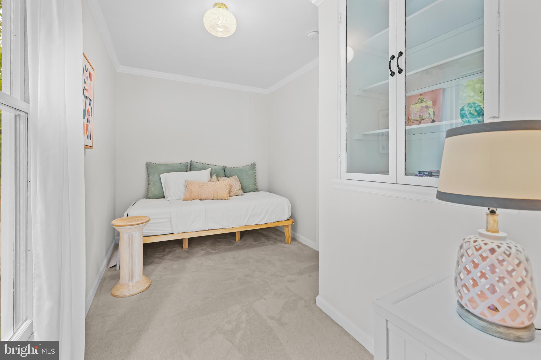20808 Wild Goose Lane Leesburg, VA 20175 - Photo 49 of 86 a bedroom with a bed and a chair