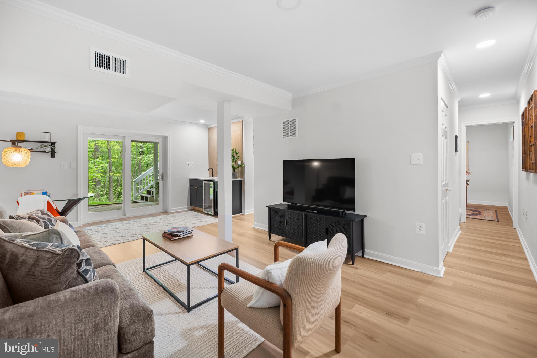 20808 Wild Goose Lane Leesburg, VA 20175 - Photo 52 of 86 a living room with furniture and a flat screen tv