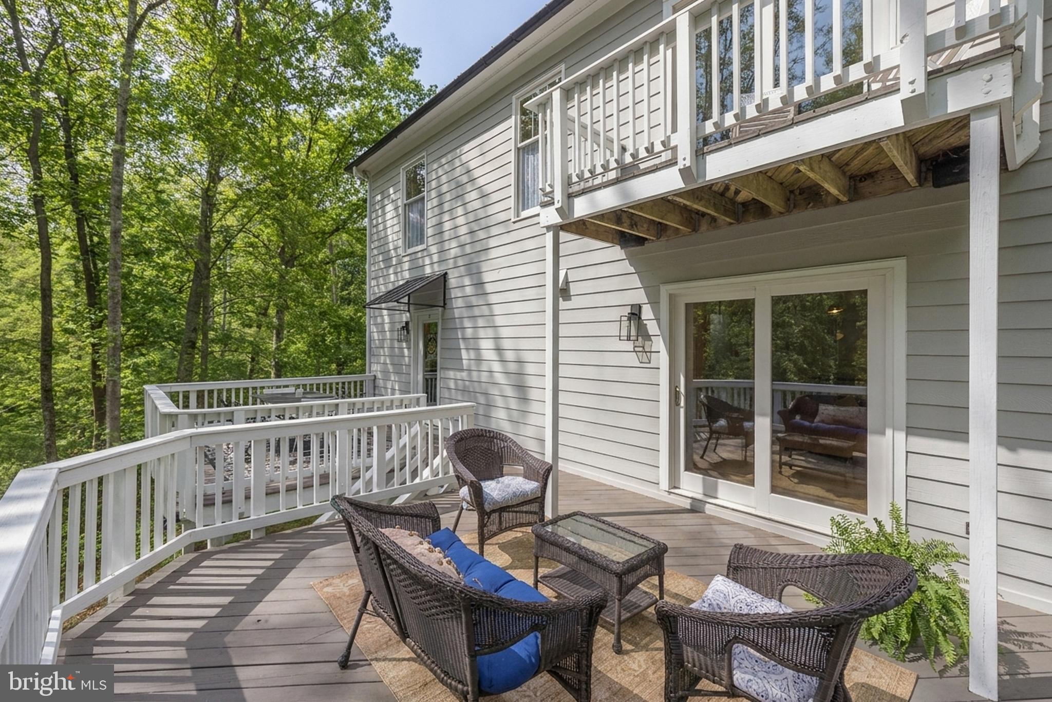 20808 Wild Goose Lane Leesburg, VA 20175 - Photo 65 of 86 a view of a chair and table in the balcony