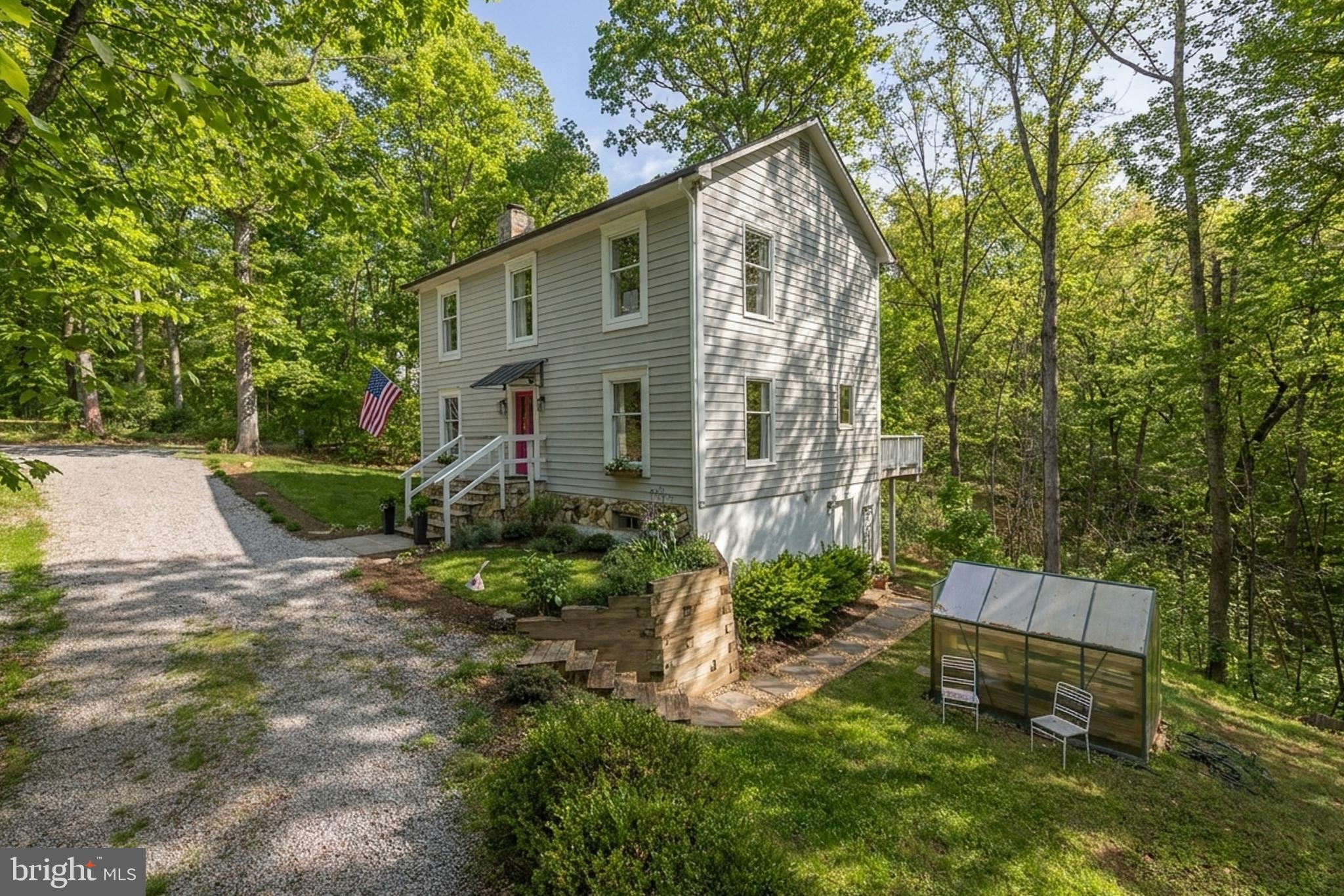 20808 Wild Goose Lane Leesburg, VA 20175 - Photo 76 of 86 a view of a house with a yard and plants
