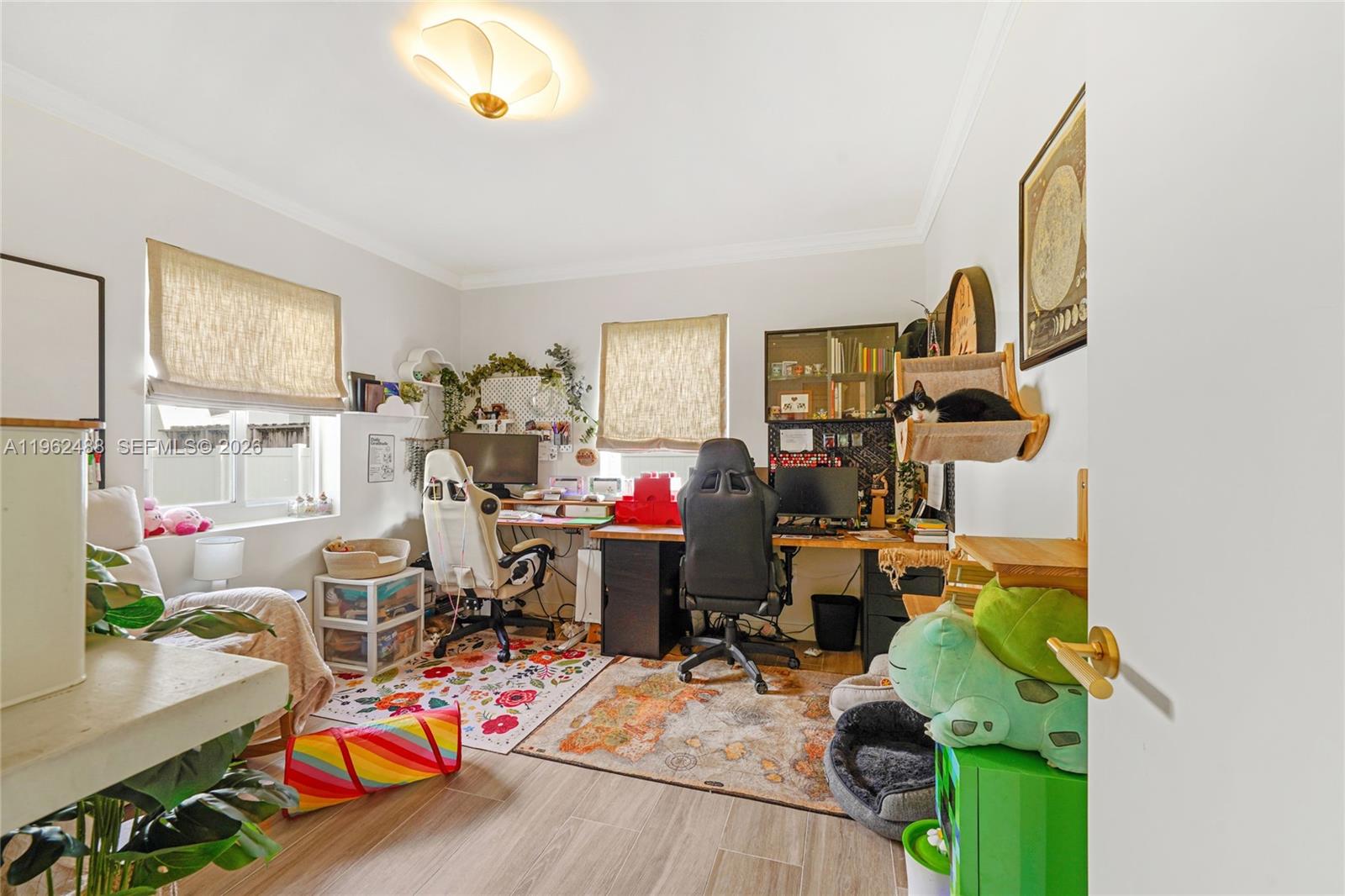 1737 Southwest 11th Street Miami, FL 33135 - Photo 17 of 30 a living room filled with furniture and a wooden floor
