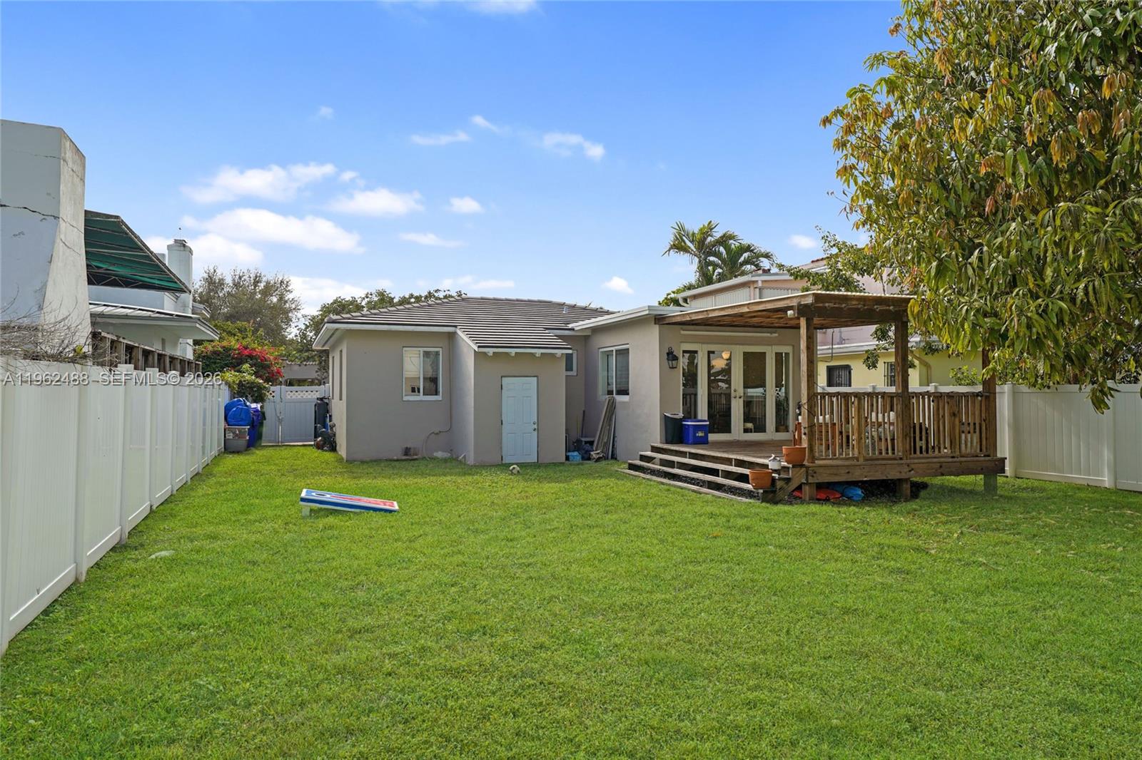 1737 Southwest 11th Street Miami, FL 33135 - Photo 24 of 30 a view of a house with a yard and deck