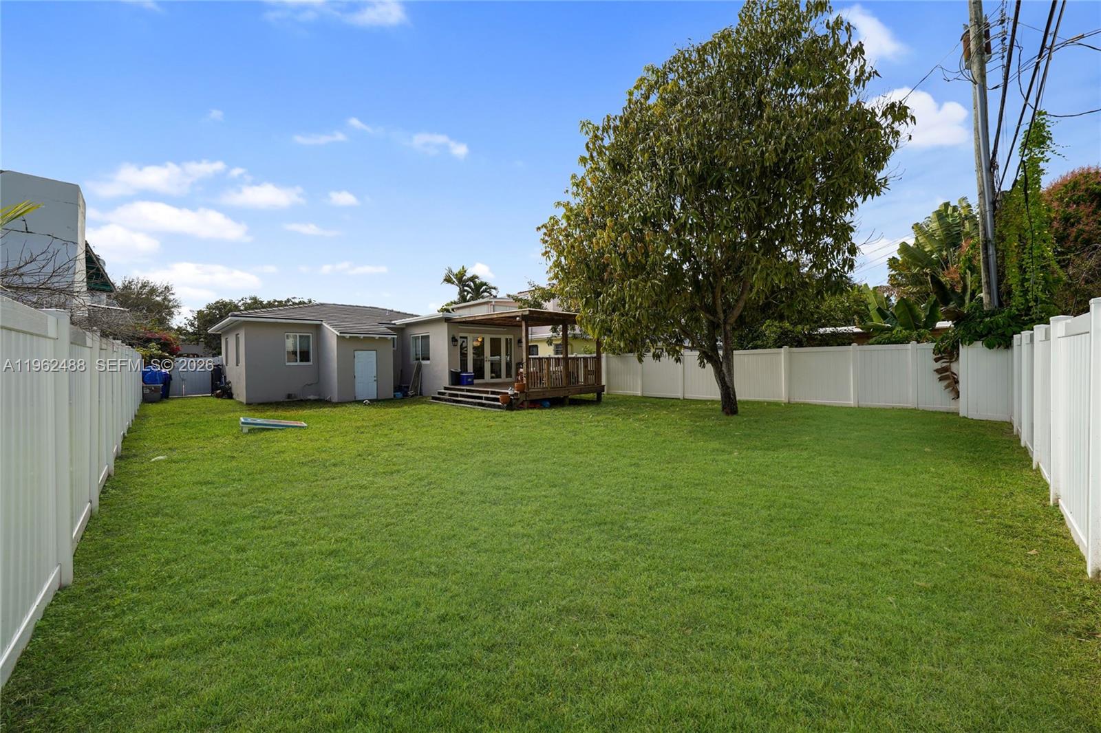 1737 Southwest 11th Street Miami, FL 33135 - Photo 25 of 30 a view of a house with a back yard