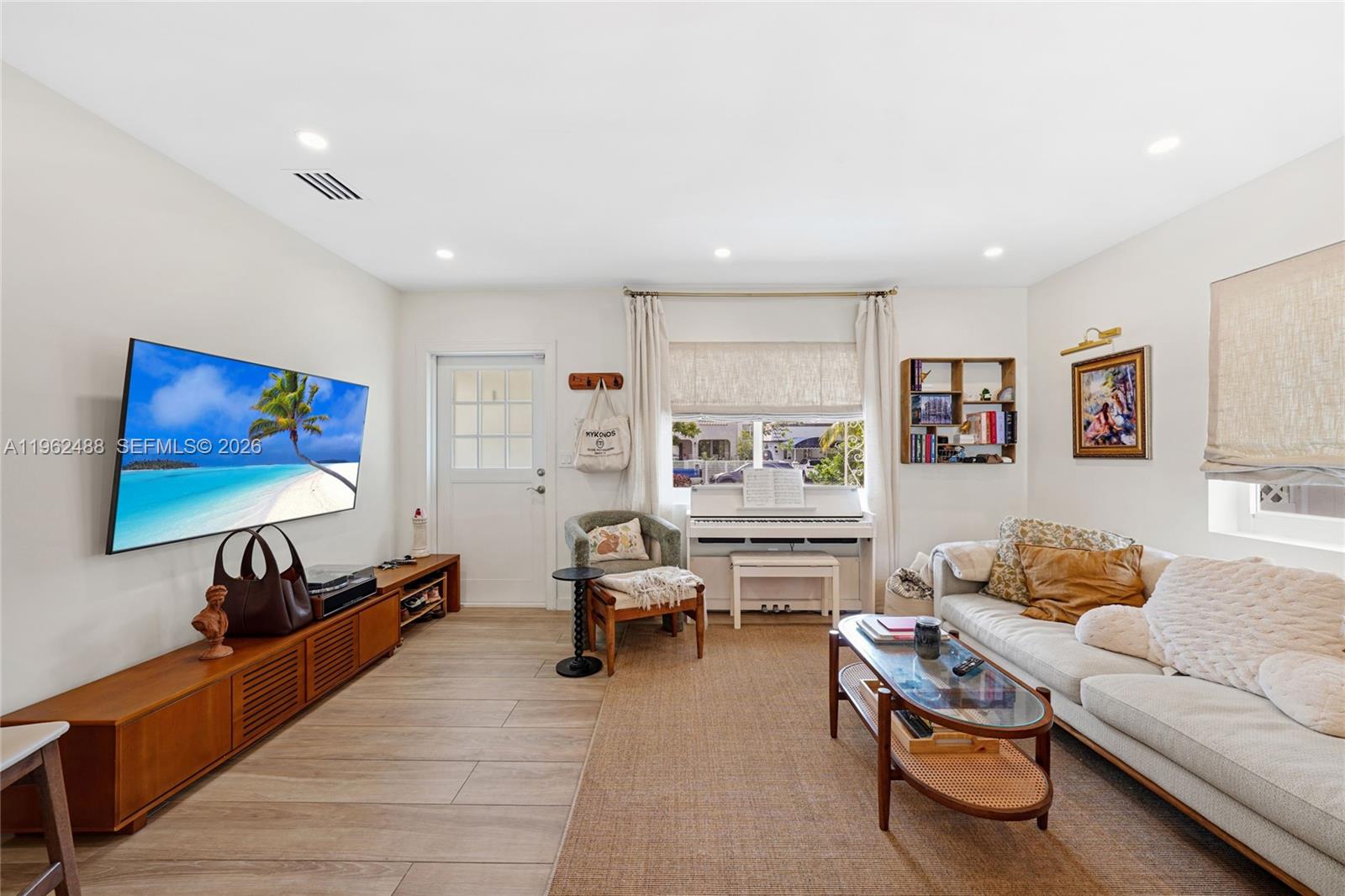 1737 Southwest 11th Street Miami, FL 33135 - Photo 10 of 30 a living room with furniture and a flat screen tv