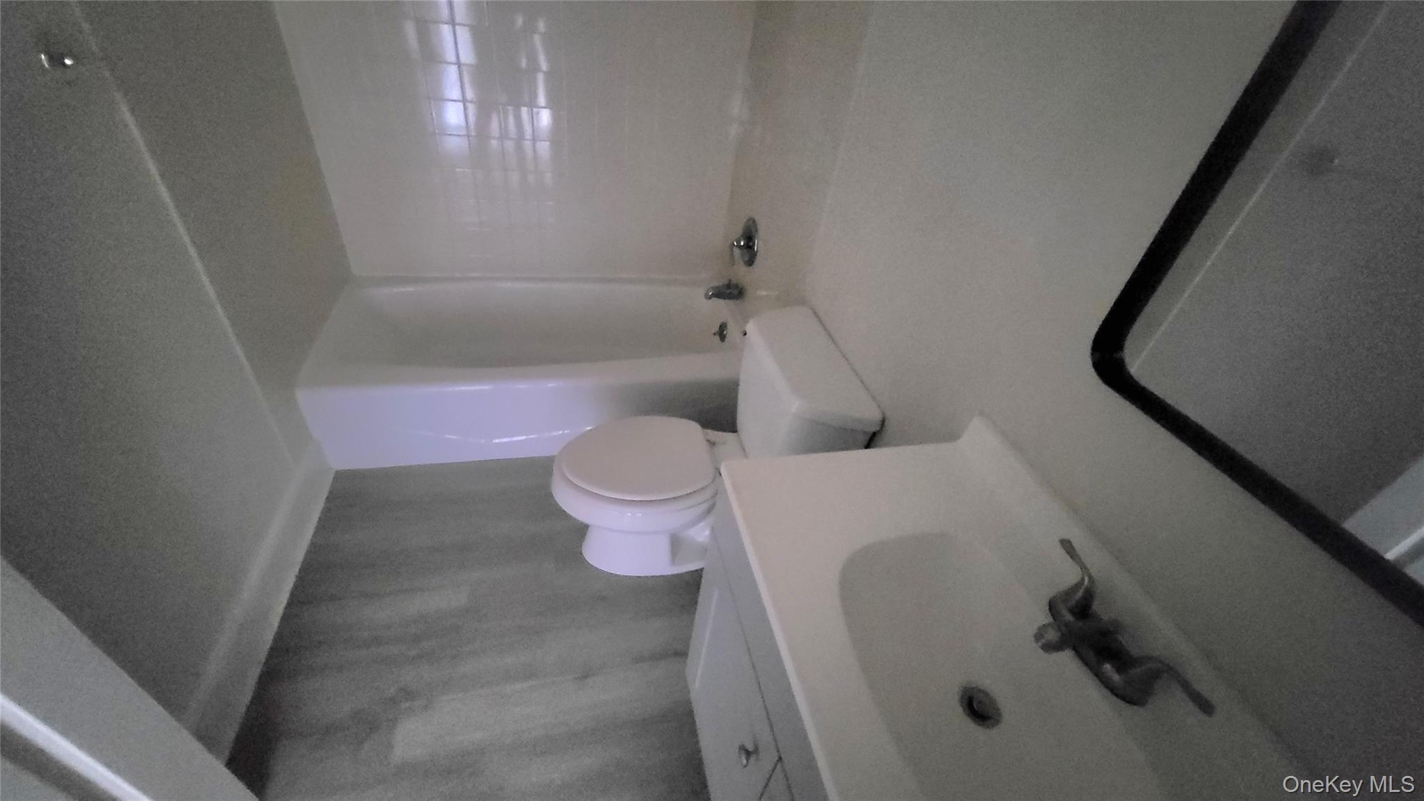 216 Church Street, Unit 2 Poughkeepsie, NY 12601 - Photo 7 of 13 Bathroom featuring vanity and shower / tub combination