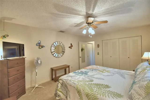 a living room with furniture and a area with kitchen view