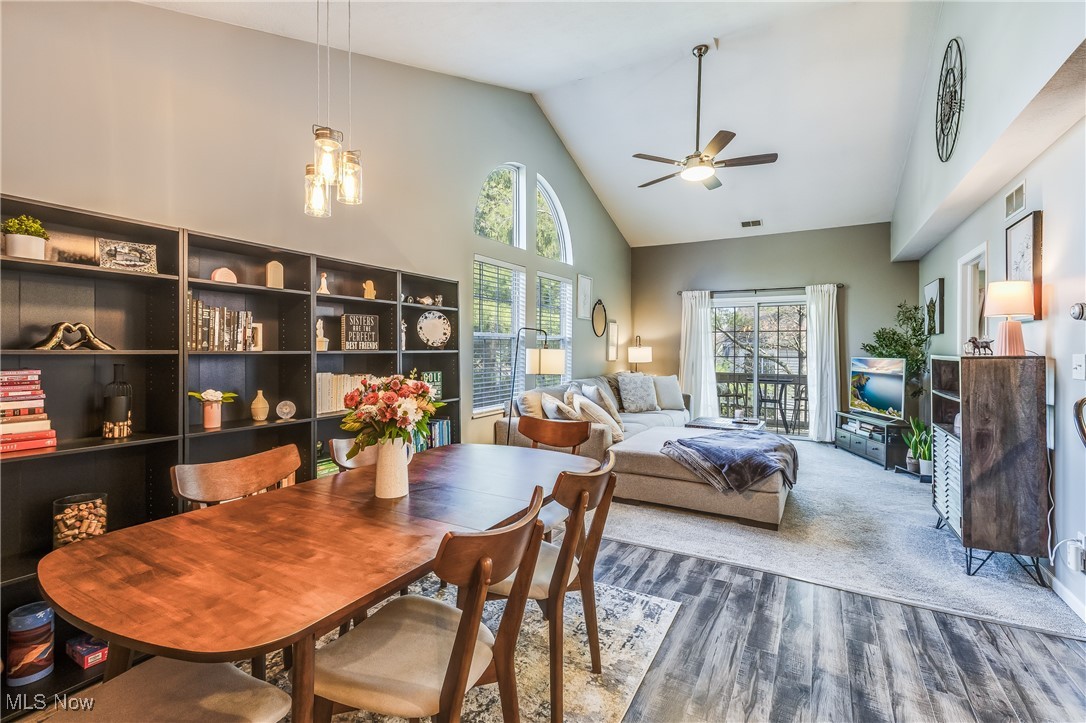 6745 Tippecanoe Road Canfield, OH 44406 - Photo 11 of 27 Dining area with wood finished floors, visible vents, a ceiling fan, and high vaulted ceiling