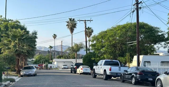 a view of a cars parked in front of a house