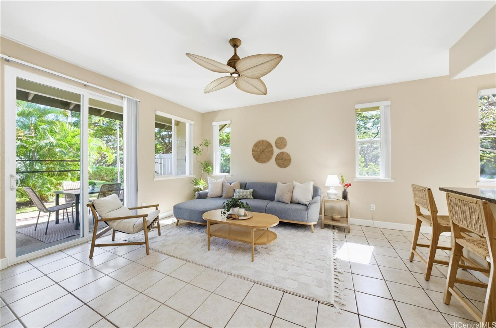 92-1532 Ali'inui Drive, Unit 1606 Kapolei, HI 96707 - Photo 6 of 25 Living room opening up to the lanai