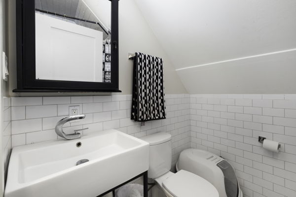 2623 North Rhodes Avenue River Grove, IL 60171 - Photo 7 of 17 a bathroom with a sink toilet and mirror