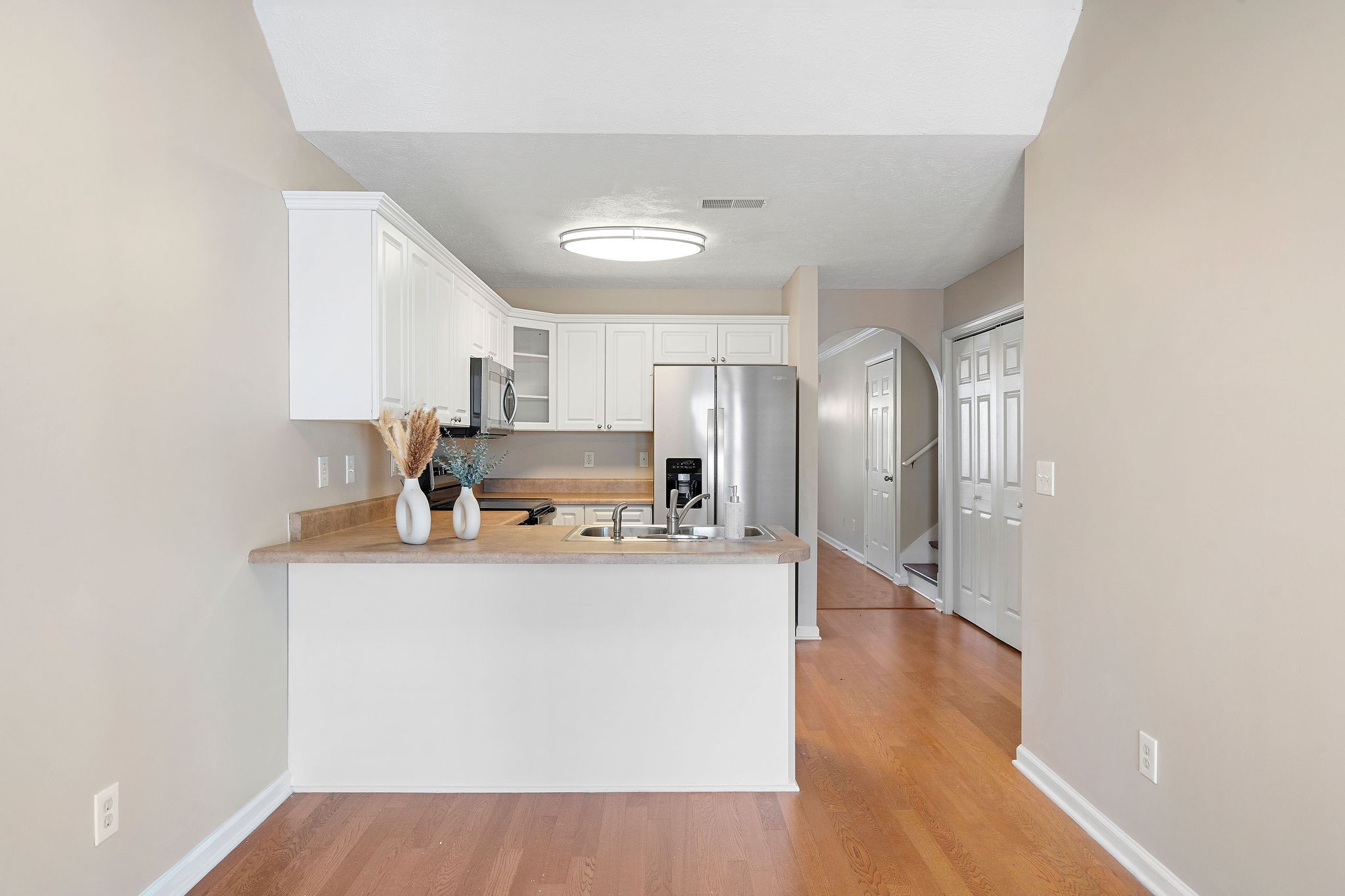 3001 Hamilton Church Road, Unit 113 Antioch, TN 37013 - Photo 11 of 30 a kitchen with stainless steel appliances granite countertop a sink stove and refrigerator