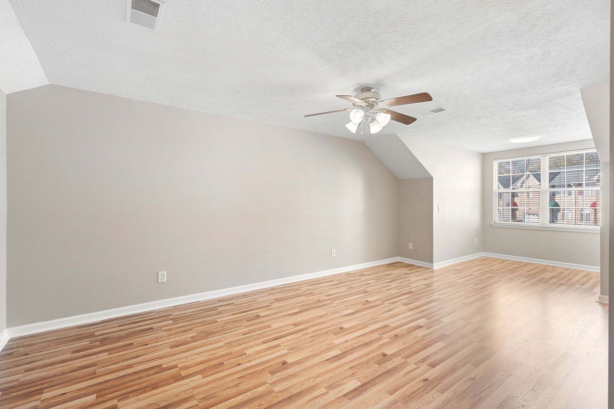3001 Hamilton Church Road, Unit 113 Antioch, TN 37013 - Photo 20 of 30 a view of an empty room with window and wooden floor