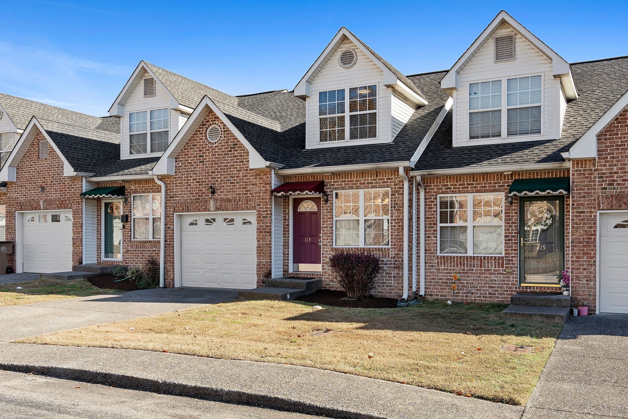 3001 Hamilton Church Road, Unit 113 Antioch, TN 37013 - Photo 2 of 30 a front view of a house with a yard