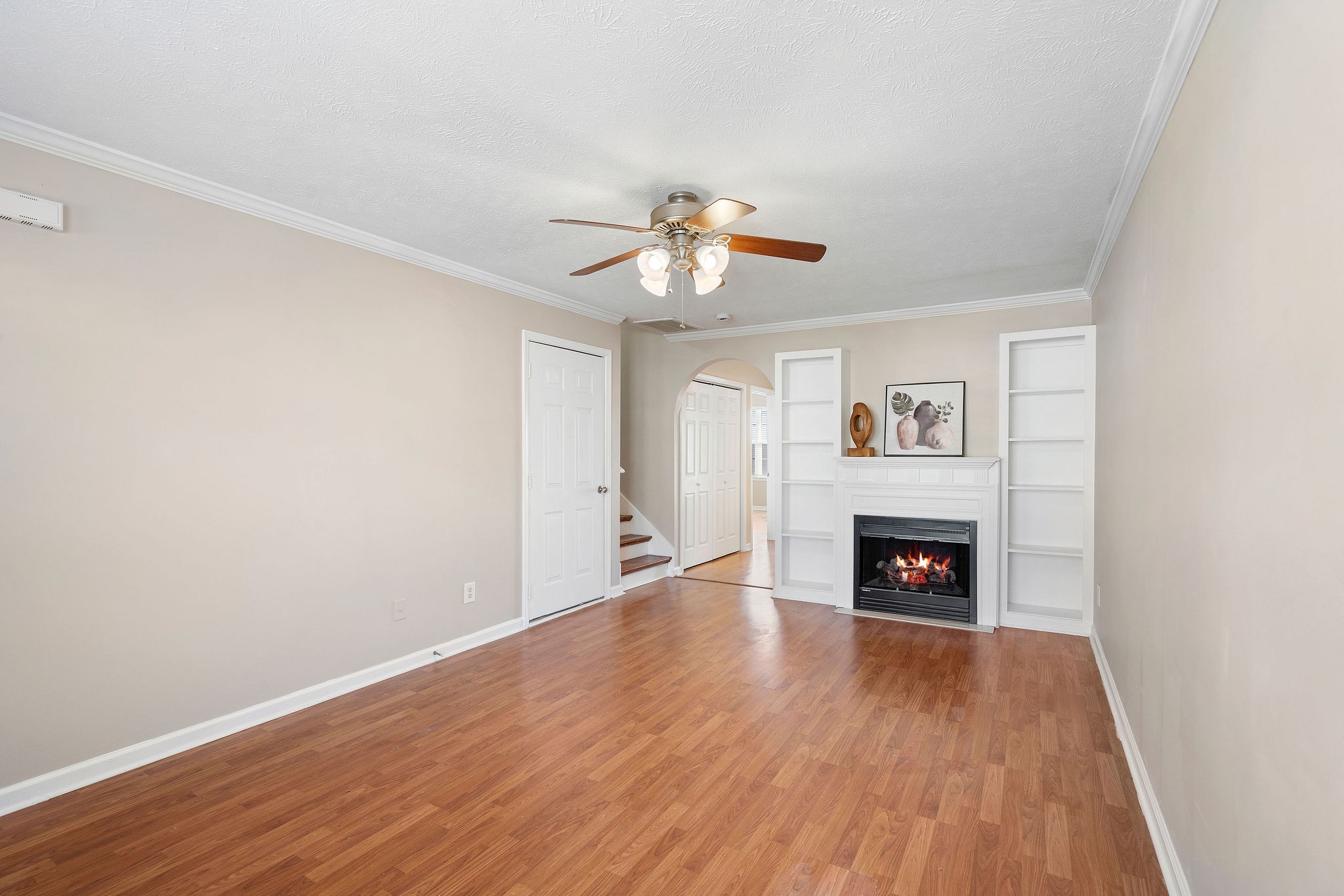 3001 Hamilton Church Road, Unit 113 Antioch, TN 37013 - Photo 6 of 30 a view of an empty room with wooden floor a fireplace and a window
