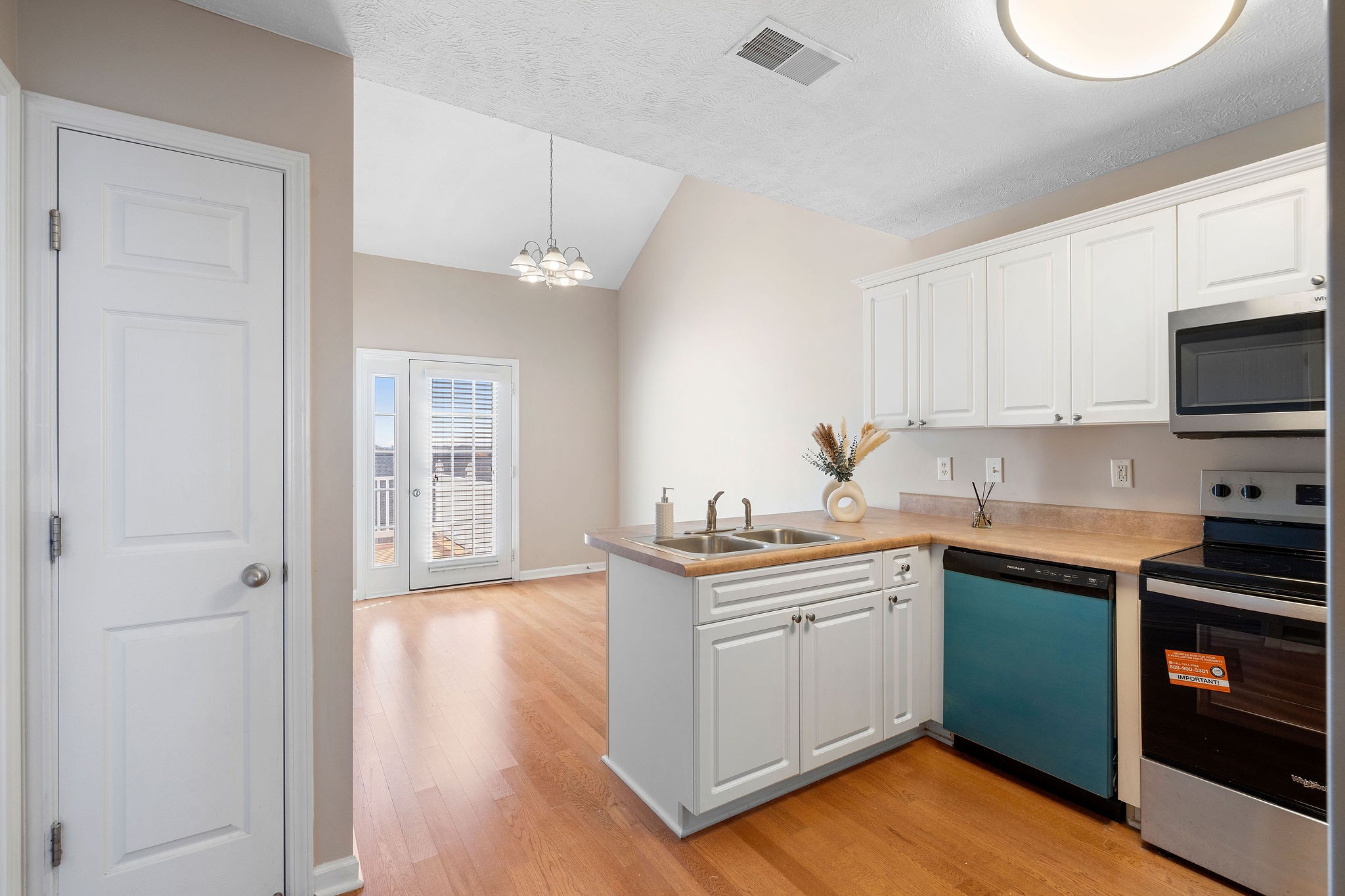 3001 Hamilton Church Road, Unit 113 Antioch, TN 37013 - Photo 9 of 30 a kitchen with a sink cabinets and wooden floor