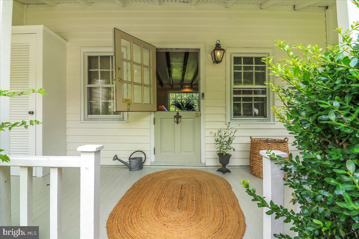 920 Cherry Valley Road Princeton, NJ 08540 - Photo 12 of 58 a front view of a house with a garden