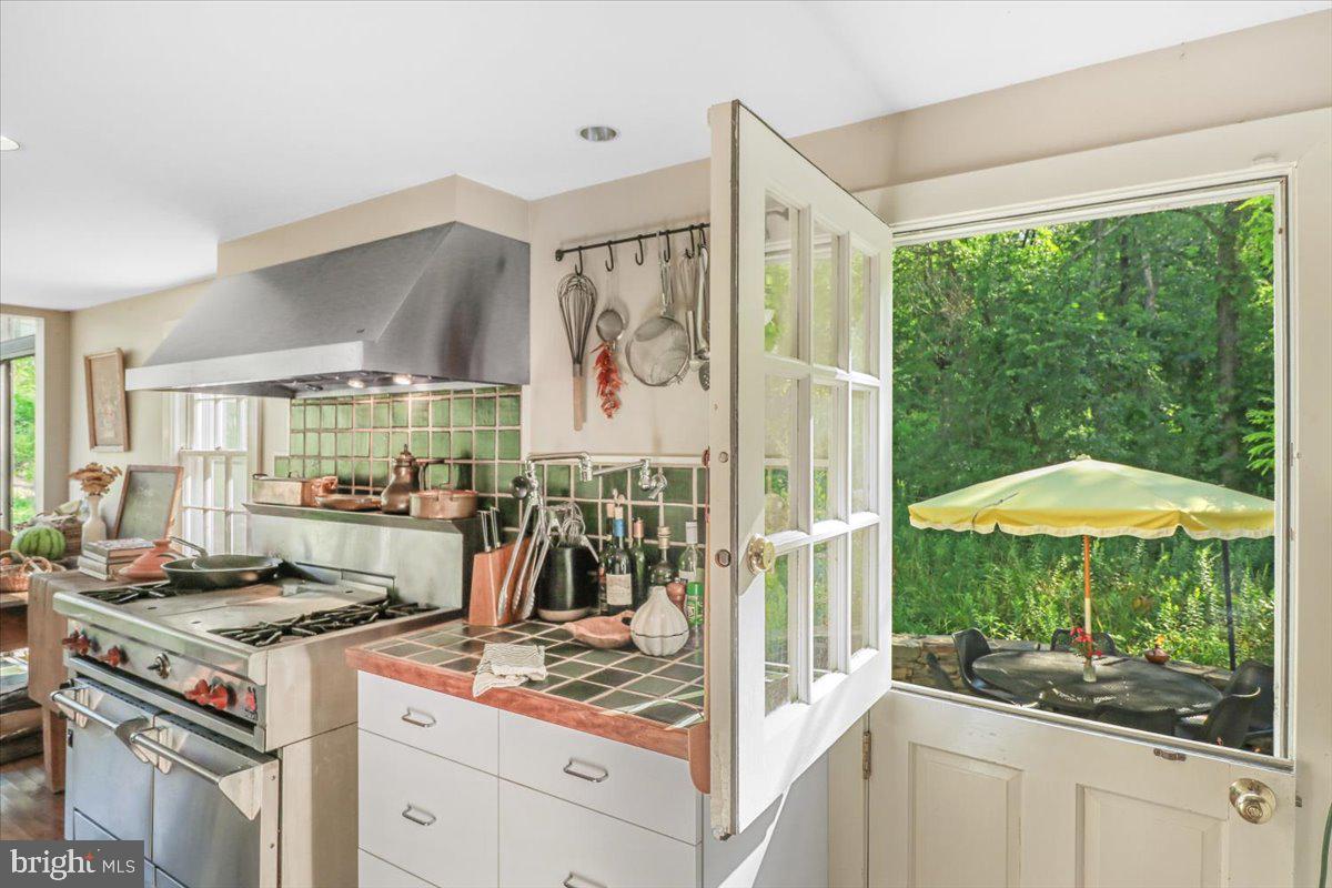 920 Cherry Valley Road Princeton, NJ 08540 - Photo 18 of 58 a kitchen with a stove a refrigerator and cabinets