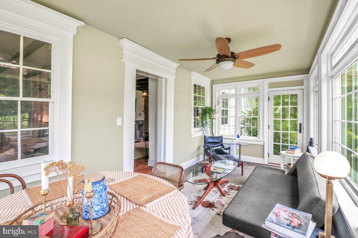 920 Cherry Valley Road Princeton, NJ 08540 - Photo 25 of 58 a living room with furniture and floor to ceiling windows