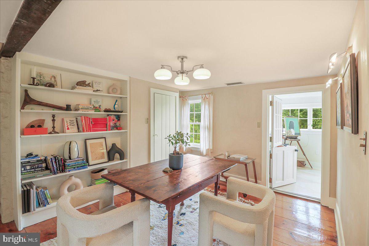 920 Cherry Valley Road Princeton, NJ 08540 - Photo 27 of 58 a view of a dining room with furniture and a potted plant