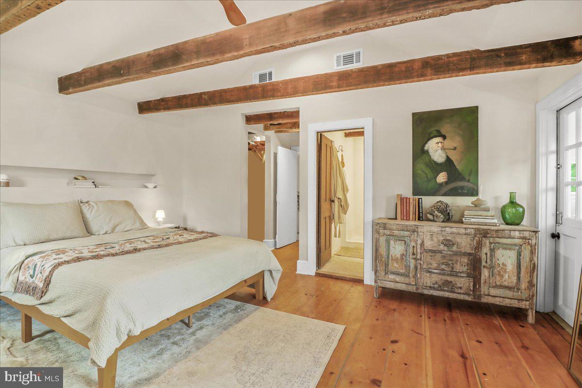 920 Cherry Valley Road Princeton, NJ 08540 - Photo 32 of 58 a spacious bedroom with a bed and a dresser