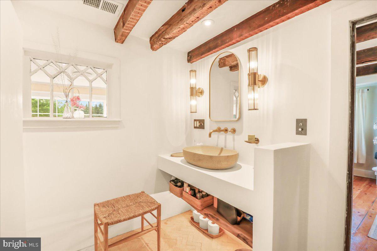 920 Cherry Valley Road Princeton, NJ 08540 - Photo 35 of 58 a bathroom with a sink and a mirror