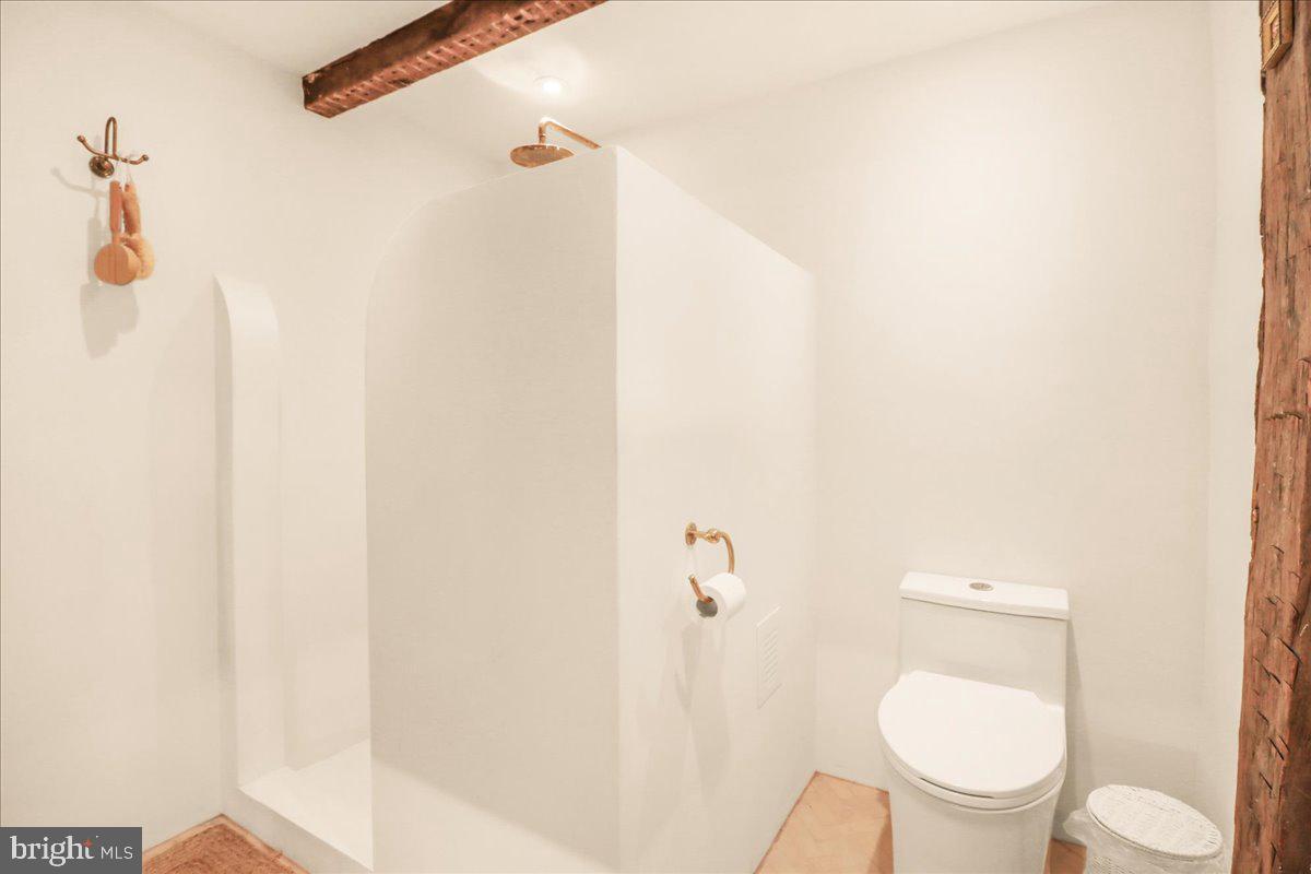 920 Cherry Valley Road Princeton, NJ 08540 - Photo 37 of 58 a white toilet sitting next to a shower