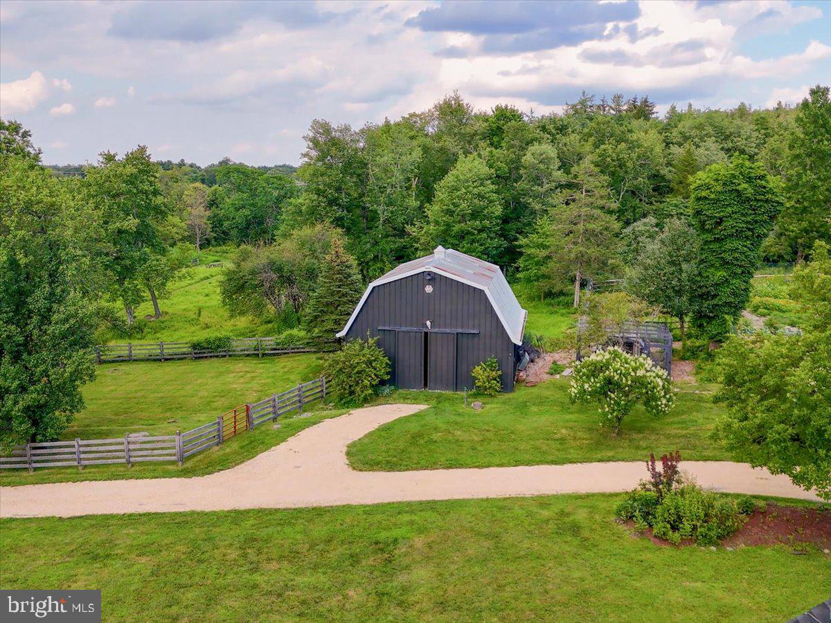 920 Cherry Valley Road Princeton, NJ 08540 - Photo 4 of 58 a view of a garden with a building in the background