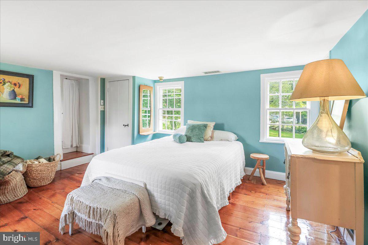920 Cherry Valley Road Princeton, NJ 08540 - Photo 44 of 58 a bedroom with a bed and wooden floor