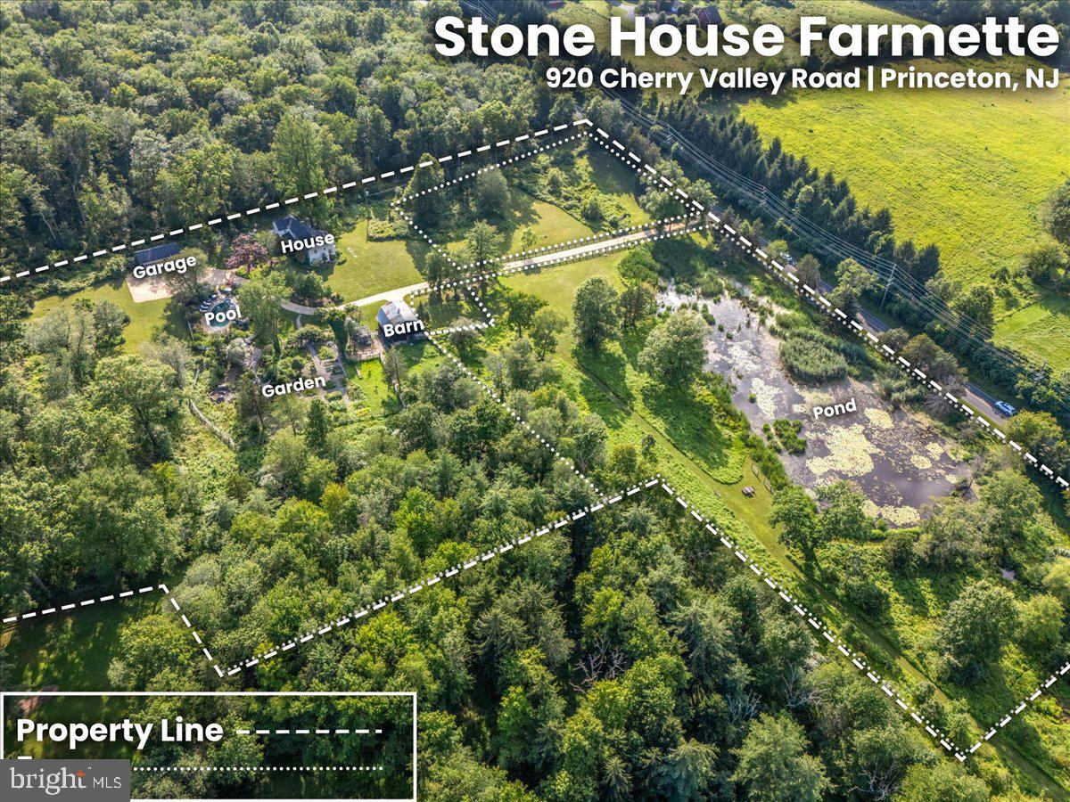 920 Cherry Valley Road Princeton, NJ 08540 - Photo 58 of 58 a view of a swimming pool with a yard and lake view