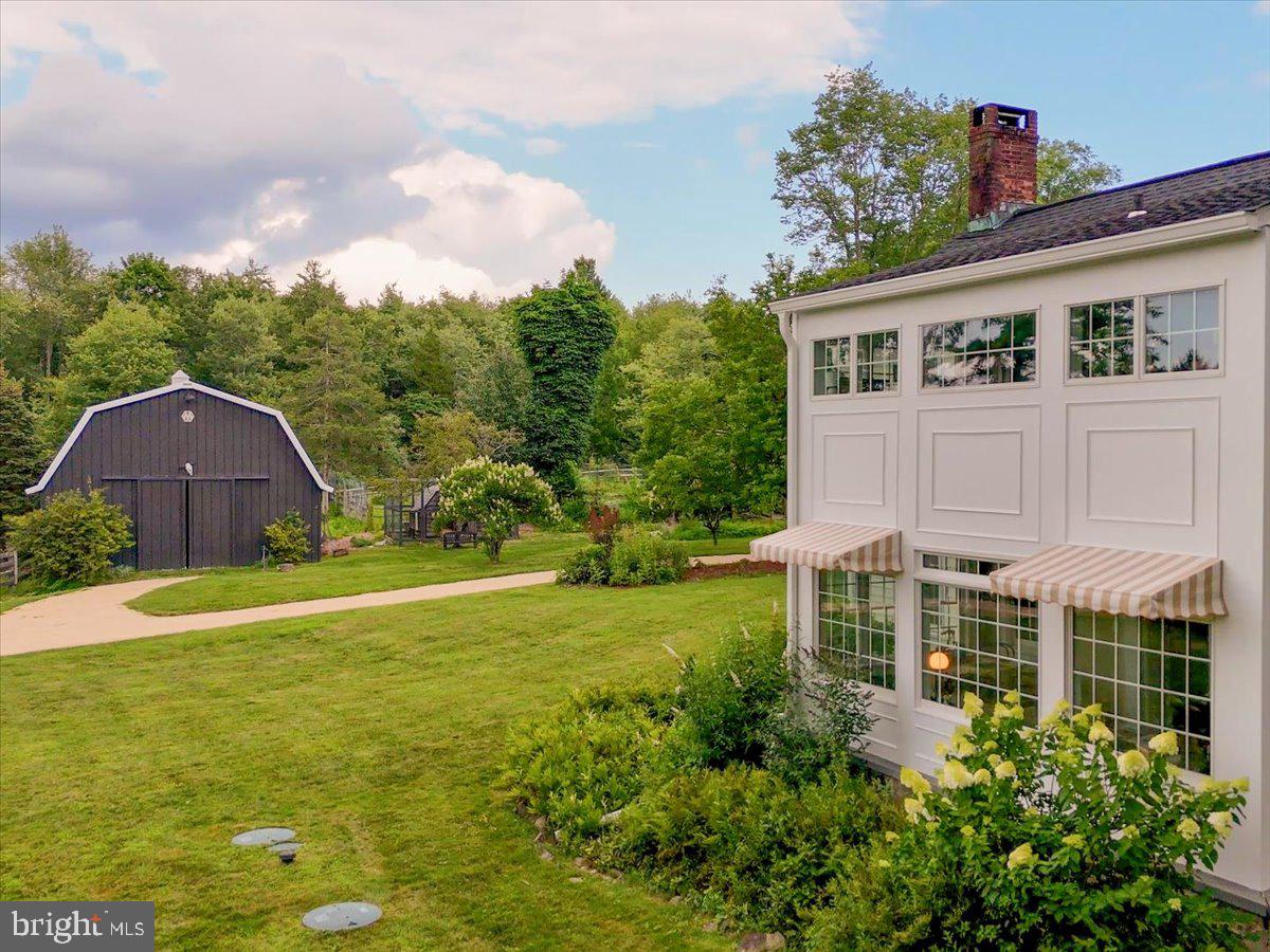 920 Cherry Valley Road Princeton, NJ 08540 - Photo 6 of 58 a view of a house with a yard and potted plants