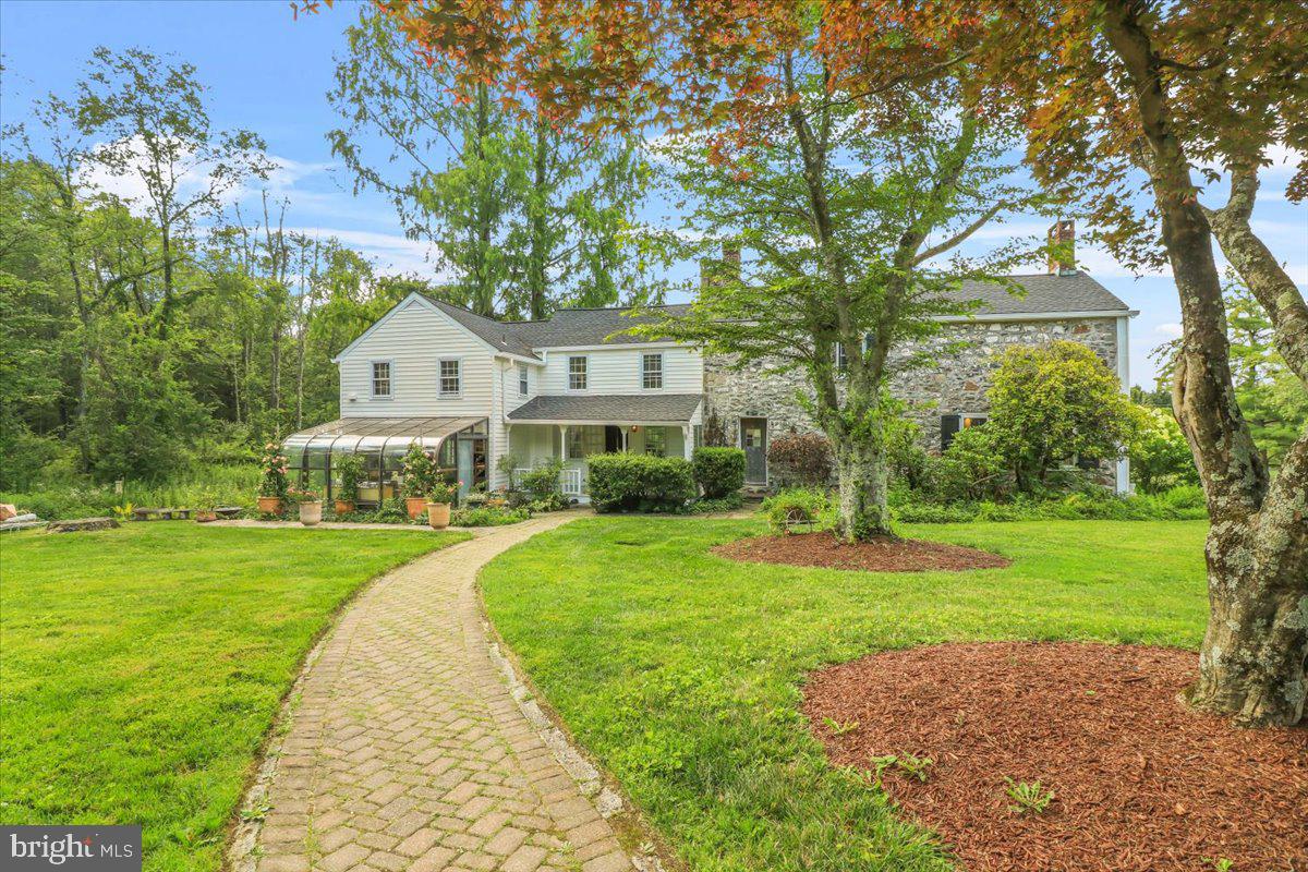 920 Cherry Valley Road Princeton, NJ 08540 - Photo 7 of 58 a front view of a house with yard and green space