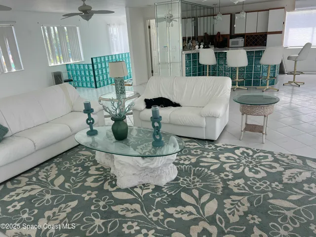 a living room with furniture and a rug