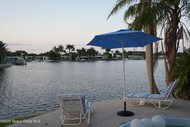 a view of a lake with outdoor seating
