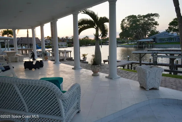 a lobby with furniture and a floor to ceiling window
