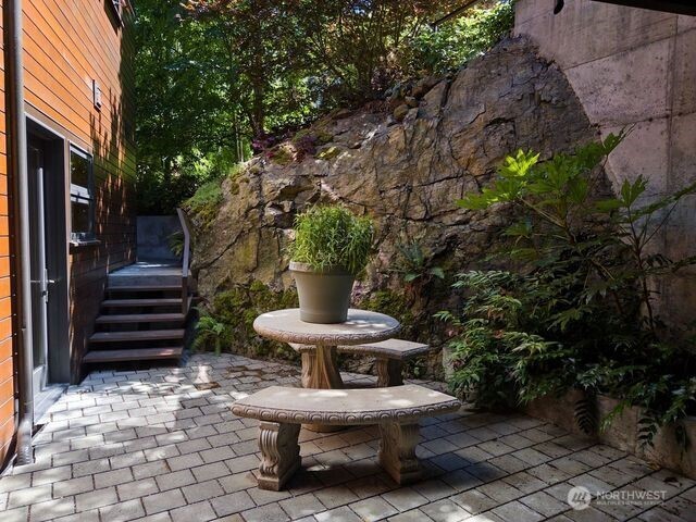 630 Harrison Street Friday Harbor, WA 98250 - Photo 14 of 37 a view of a house with backyard outdoor seating and plants