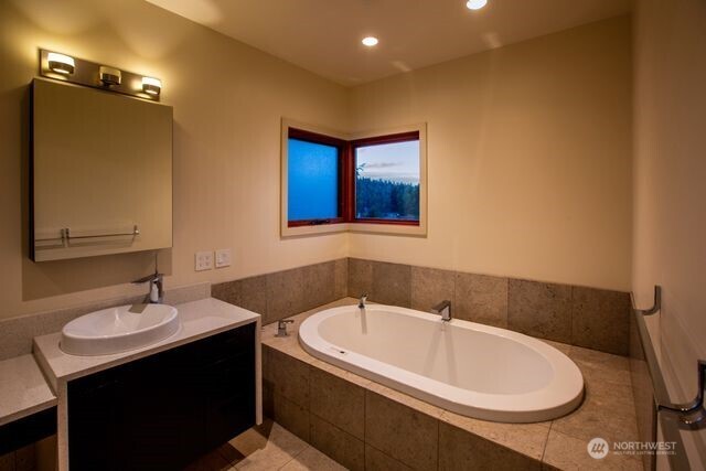 630 Harrison Street Friday Harbor, WA 98250 - Photo 21 of 37 a bathroom with a sink and a bathtub