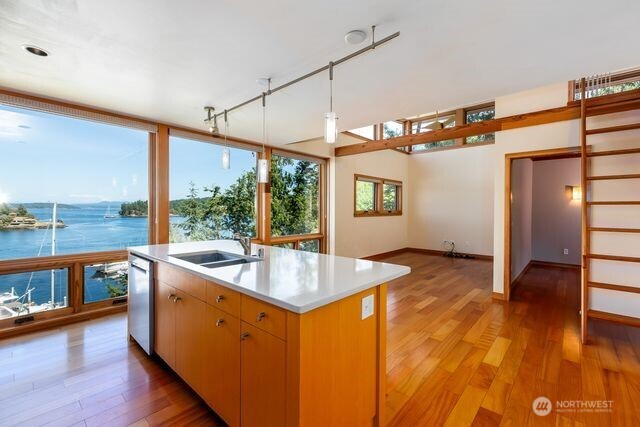 630 Harrison Street Friday Harbor, WA 98250 - Photo 32 of 37 a kitchen with a sink and wooden floor