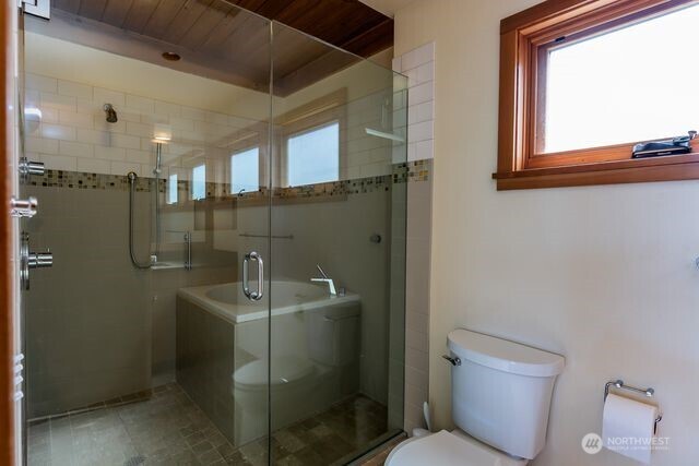 630 Harrison Street Friday Harbor, WA 98250 - Photo 34 of 37 a bathroom with a toilet sink and mirror