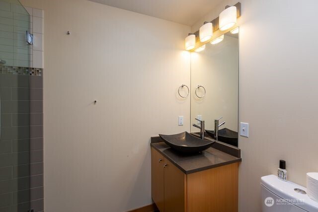 630 Harrison Street Friday Harbor, WA 98250 - Photo 35 of 37 a bathroom with a sink and a mirror