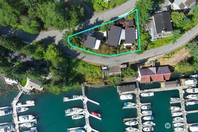 630 Harrison Street Friday Harbor, WA 98250 - Photo 37 of 37 an aerial view of a house with a garden and lake view